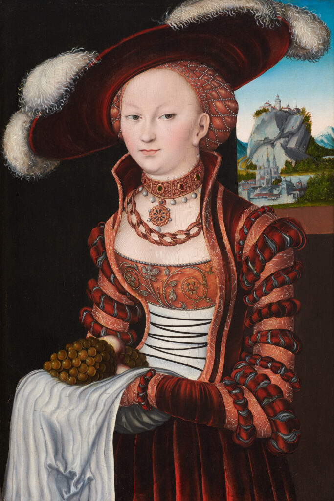Lucas Cranach l’Ancien, Portrait d’une jeune femme tenant des raisins et des pommes, 1528, huile sur panneau, transposée sur toile. Clark Art Institute, don de la fondation Aso O. Tavitian, 2025.1.9